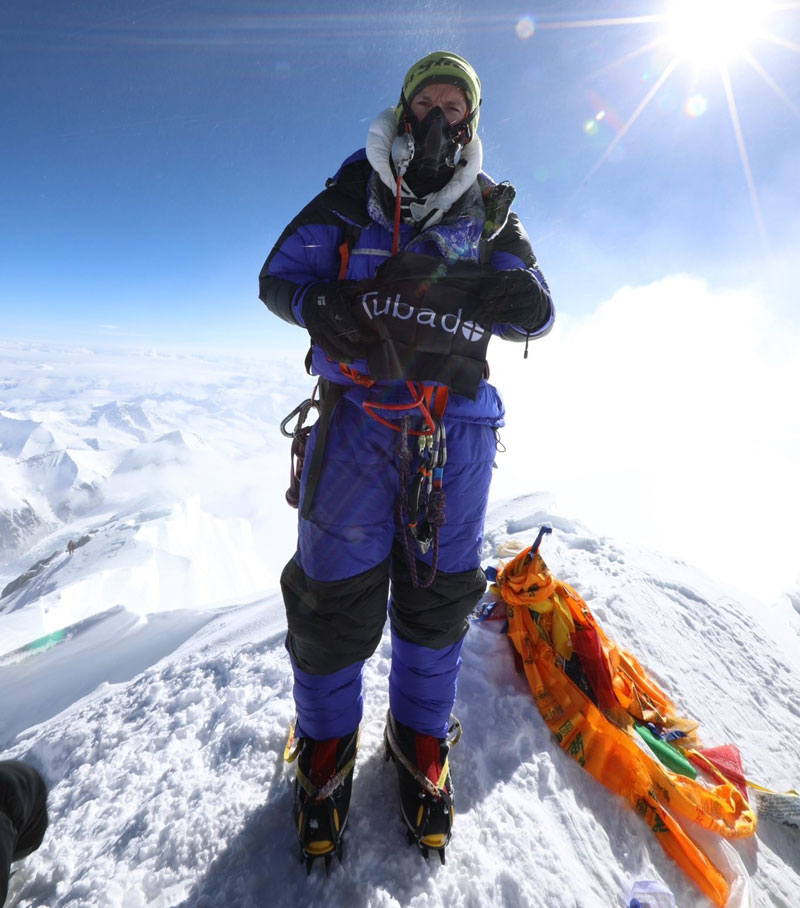 Tim Mosedale flying the Tubado flag atop of Mount Everest, 8,848 M.